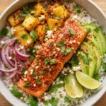 Pineapple Tajin Salmon Rice Bowls with avocado and cilantro on top