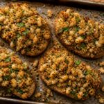 Crispy herby white bean toast crumbles on a sheet pan, golden and aromatic
