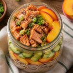 Miso Peach Salmon Soba Jars layered in a glass jar with soba noodles, salmon, peaches, cucumber, and avocado