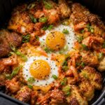 Air fryer kimchi potato egg smash with crispy golden potatoes, eggs, and green onions