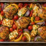 Citrus olive oil chicken and halloumi traybake on a sheet pan with roasted vegetables